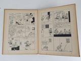 an old comic book opened to show a page of comics