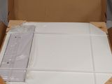 a cardboard box with a mattress inside of it