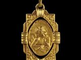 a close up of a gold pendant on a black background