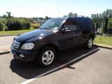 a picture of a black suv parked in a parking lot