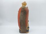 an image of a figurine of a man with a hat on his head