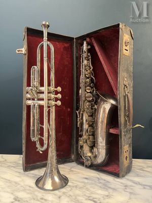 an image of a silver trumpet and a silver trumpet in a case