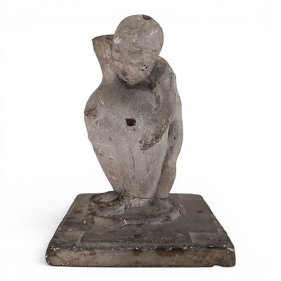 an image of a statue of a man sitting on top of a stone block