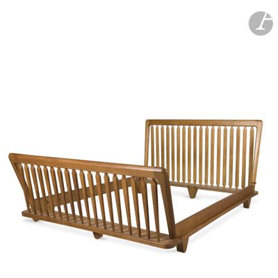 a wooden bed frame with a wooden slatt on it