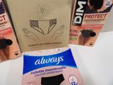 three packages of underwear sitting on a table next to each other