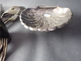 a spoon, fork, and spoon rest on a table
