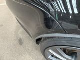 a close up of a car ' s front bumper with a hole in it