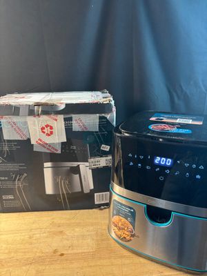 a close up of a coffee maker on a table next to a box of coffee