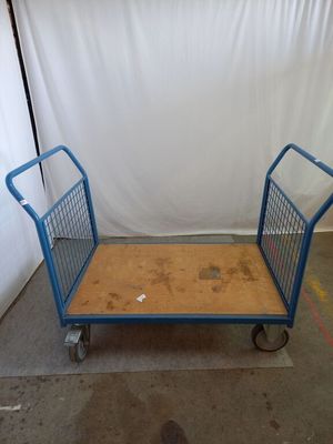 a blue cart that is sitting in a room