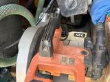 a pile of assorted items and tools on a table