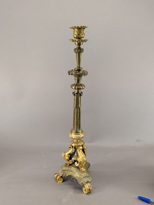 pair of antique brass candlesticks with cherenshes and cherenshes on them