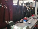 a machine that is sitting on a workbench in a garage