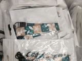 a white bag filled with items sitting on a couch
