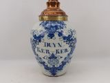 an image of a blue and white vase with a gold lid