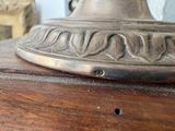a close up of a metal object on a wooden table