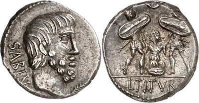 a silver coin with an image of a man and a woman on it