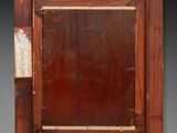 an old wooden frame with a picture of a man and a woman
