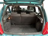 the back of a car with the trunk open and the seats folded down