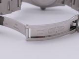 an image of a close up of a wrist watch on a white surface