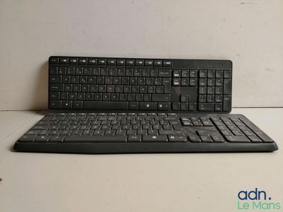 a black keyboard and a mouse on a table