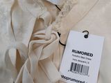 an image of a white dress with a price tag on it