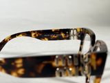 glasses are sitting on a white surface with a white background