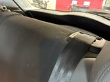a black seat belt that is attached to the dashboard of a car