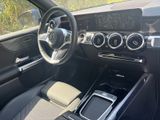 the interior of a car with a steering wheel, dashboard, and dashboard controls
