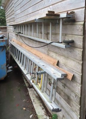 a picture of a ladder leaning against a house