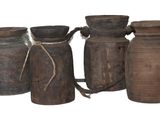 four vases that are sitting next to each other