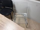 two chairs and a table in the corner of a room