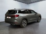 the rear end of a silver suv parked in a garage