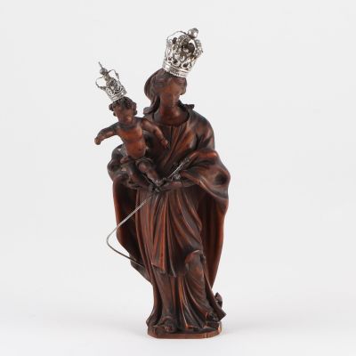 a statue of a woman holding a baby and a crown