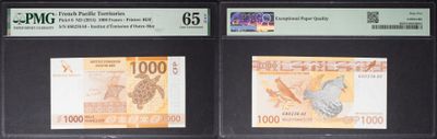 four different currency notes are on display in a display case