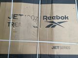 a cardboard box with a logo on it sitting on the floor