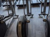 many stationary exercise bikes in a row in the gym