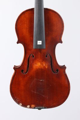 an old violin with a bow hanging from it ' s back