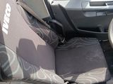 a picture of a car with a steering wheel and seat covers