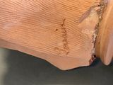 a close up of a piece of wood with writing on it