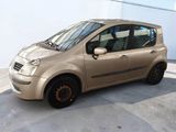 a small car that is parked in a parking lot