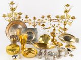 a lot of gold and silver items on a white surface