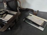 a suitcase and a cell phone sitting on a table