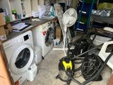 a washing machine and a dryer in a garage