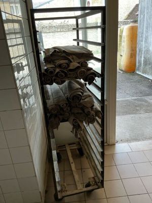 a stack of towels on a rack in a room
