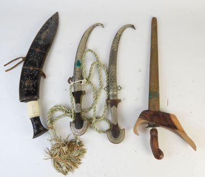 several different types of knives are displayed on a white surface