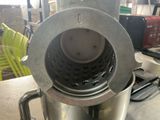 a silver blender sitting on a counter in a kitchen