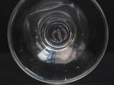 a close up of a wine glass on a table
