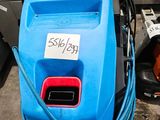 a blue machine that is sitting on the floor