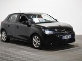 a picture of a black car parked on a checkered floor
