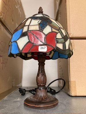 a lamp that is sitting on a table next to a box